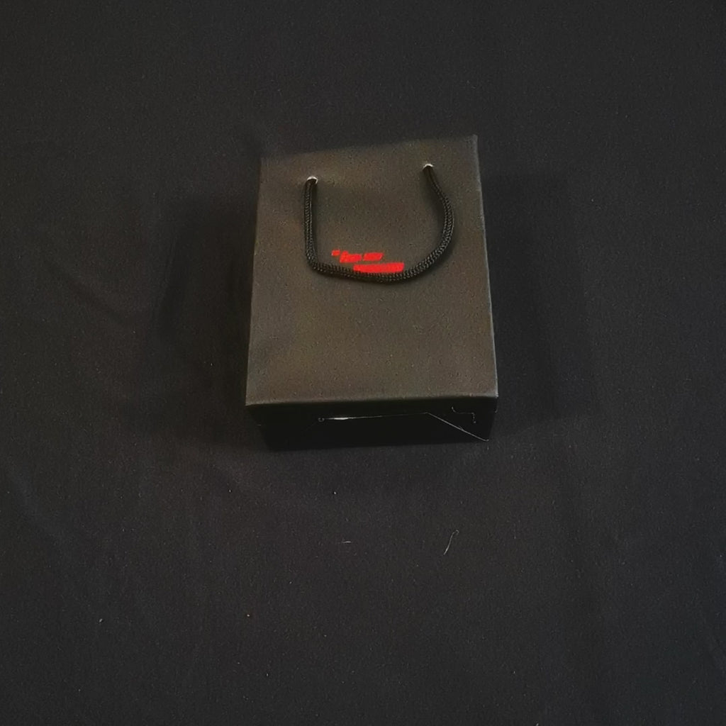 unpacking a freakshow package containing a bronze mummy zippo lighter 